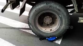 Helmet saves scooter driver’s life after his head is run over by truck in China