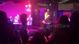 Woman has 'Titanic' fail leaping into man's arms during karaoke show