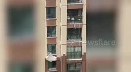 Kind-hearted people use duvets to catch boy falling from fifth-floor balcony in China