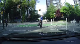 Man gleefully dances across road in Vancouver, Canada