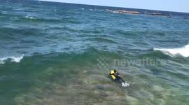 Woman on Bodyboard versus Lake Superior Waves