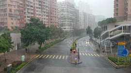 Fire Truck driving through stormy Kowloon, Hong Kong as Tropical Cyclone Wipha approaches