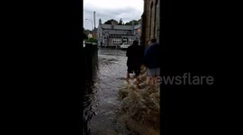 Leyburn residents wade through floodwater after heavy downpours hit North Yorkshire