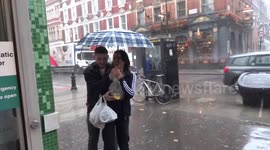 Kissing in the rain outside Marks and Spencer Earls Court - London