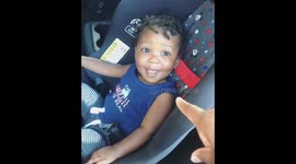 'Who me?' Toddler can't keep a straight face as mom lectures him