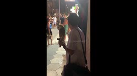 Guy walking around with an Owl for tourist to take photos for money