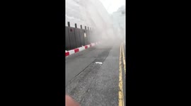 Workers rush to scene of collapsed scaffolding as dust fills the air in Reading