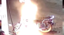 Alleged drunk man sets his own motorbike on fire at petrol station in China