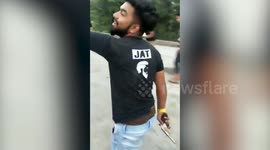 Moment man cuts his birthday cake by firing it with a GUN