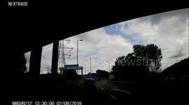 Idiot on a motorway island causes a near miss