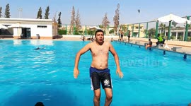 Expert Swimming Pool Diver Flips Over