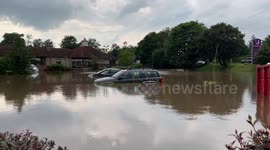 Cars float in water at Grangemouth Premier Inn car park in Scotland amid heavy flooding after severe thunderstorm