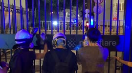Crowds scream expletives at Hong Kong police as they lay siege to Kwun Tong Police Station in Kowloon