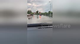 Cars plough through submerged Nottingham road after flooding