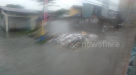 Flood water submerges roads in the Philippines during Storm Hanna