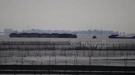 Mysterious mirage of an ancient city appears over Chinese lake