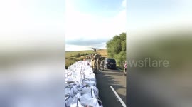 Newsflare Edit - RAF Chinook captured picking up sandbags to take to Whaley Bridge dam