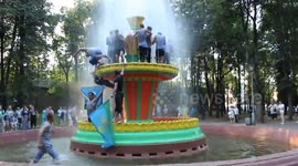 Russian men bathe in the fountain