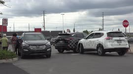 Three car accident in parking lot near Toronto ends up looking like a tailgate party as they all try and figure out why running a stop sign is a bad thing
