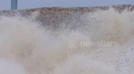 Water gushing over dam from reservoir in Whaley Bridge