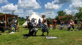 Knight in shining amour! US man proposes after challenging girlfriend to a medieval sword fight