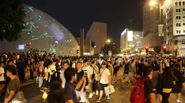 Protesters in Hong Kong during a laser pen protest manage traffic in the area