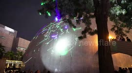 Hong Kong protestors perform laser light show to support student arrested for purchasing laser pen