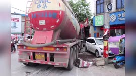 Out of control cement tanker narrowly misses man crossing road in China