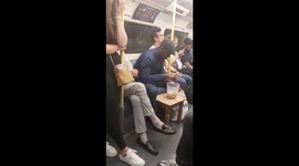 UK man makes a cup of tea with a jug and kettle while on the tube