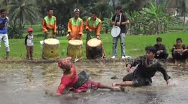This traditional form of Indonesian martial arts sees two people battle it out in a muddy rice field