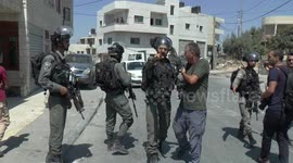 Israeli troops raise military checkpoints while investigating fatal stabbing of soldier