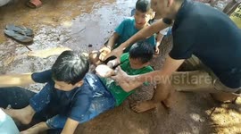 The children participating in the game of moving flour
