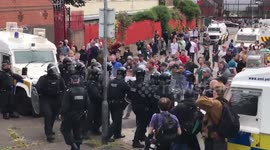 PSNI officer knocked to the ground as trouble breaks out at Belfast bonfire site