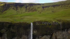 Drone footage of enchanting waterfall in Iceland
