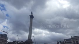 Dark rain clouds over Nelson's Column in London