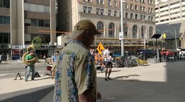 Groovy street band plays outside in downtown Toronto