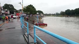 Cars submerged after river bursts its banks during rainstorm from Typhoon Lekima
