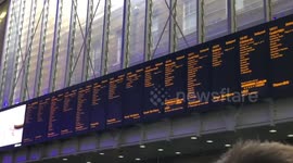 During a London power outage hundreds of commuters pile out of Kings Cross station