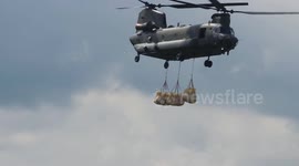 RAF Chinook drops 300 bags of ballast into hole in Toddbrook Reservoir overspill