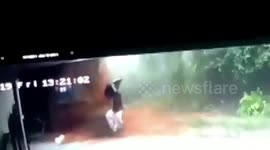 Dramatic moment a man escapes a landslide, while his family is trapped