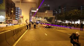 Anti Extradition Protest, Hong Kong 10th August 2019. Protesters shining laser pens towards approaching riot police and graffiti on a taxi who attempted to drive through barricades