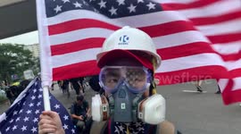 Hong Kong protesters wave US flags before police crackdown