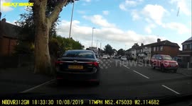 Car being chased by police forcing cars out the way