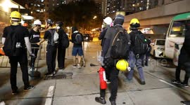 Hong Kong Protesters try to block a road In Kwai Fong, police respond with tear gas