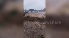 Buildings and roads collapse in flooding caused by typhoon Lekima in China