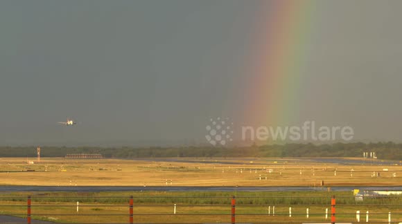 Plane lands at German airport with a stunning rainbow backdrop