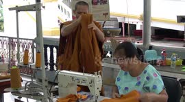 Buddhist monks are recycling plastic bottles by turning them into sacred orange robes  (no subtitles)