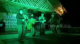 Unique moment tribal shamans dance with police chief on stage during festival karaoke