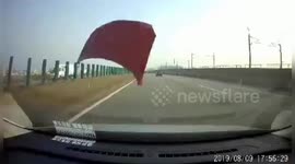 Bonnet smashes car window after being blown off by strong winds in China