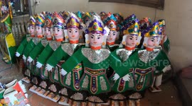 A creepy village specializes in producing paper effigies for the dead